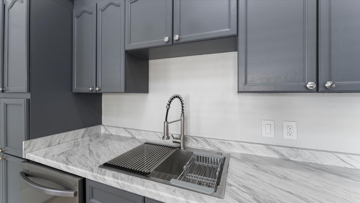 3123 Patience Avenue Houston, TX 77014 - Photo 10 of 22 a kitchen with a sink and cabinets