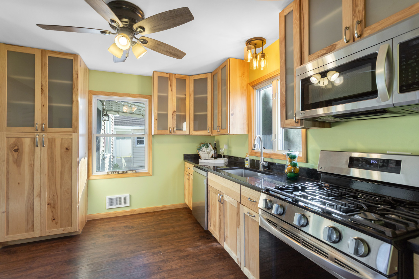 8635 44th Place Lyons, IL 60534 - Photo 4 of 15 a kitchen with stainless steel appliances granite countertop a stove and a sink