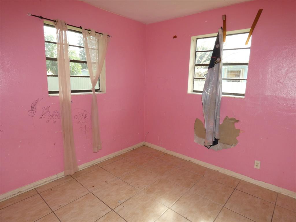 82 Tortuga Road Palm Springs, FL 33461 - Photo 11 of 17 a view of a livingroom with windows