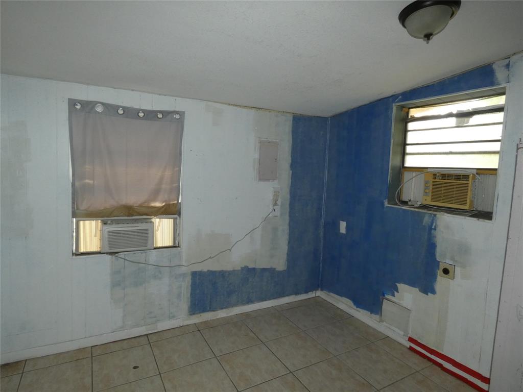 82 Tortuga Road Palm Springs, FL 33461 - Photo 13 of 17 a view of an empty room with a window