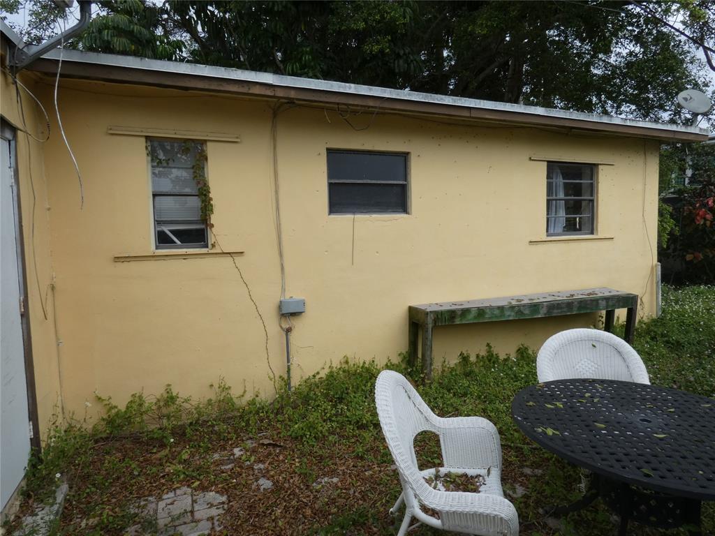 82 Tortuga Road Palm Springs, FL 33461 - Photo 5 of 17 a front view of a house with garden