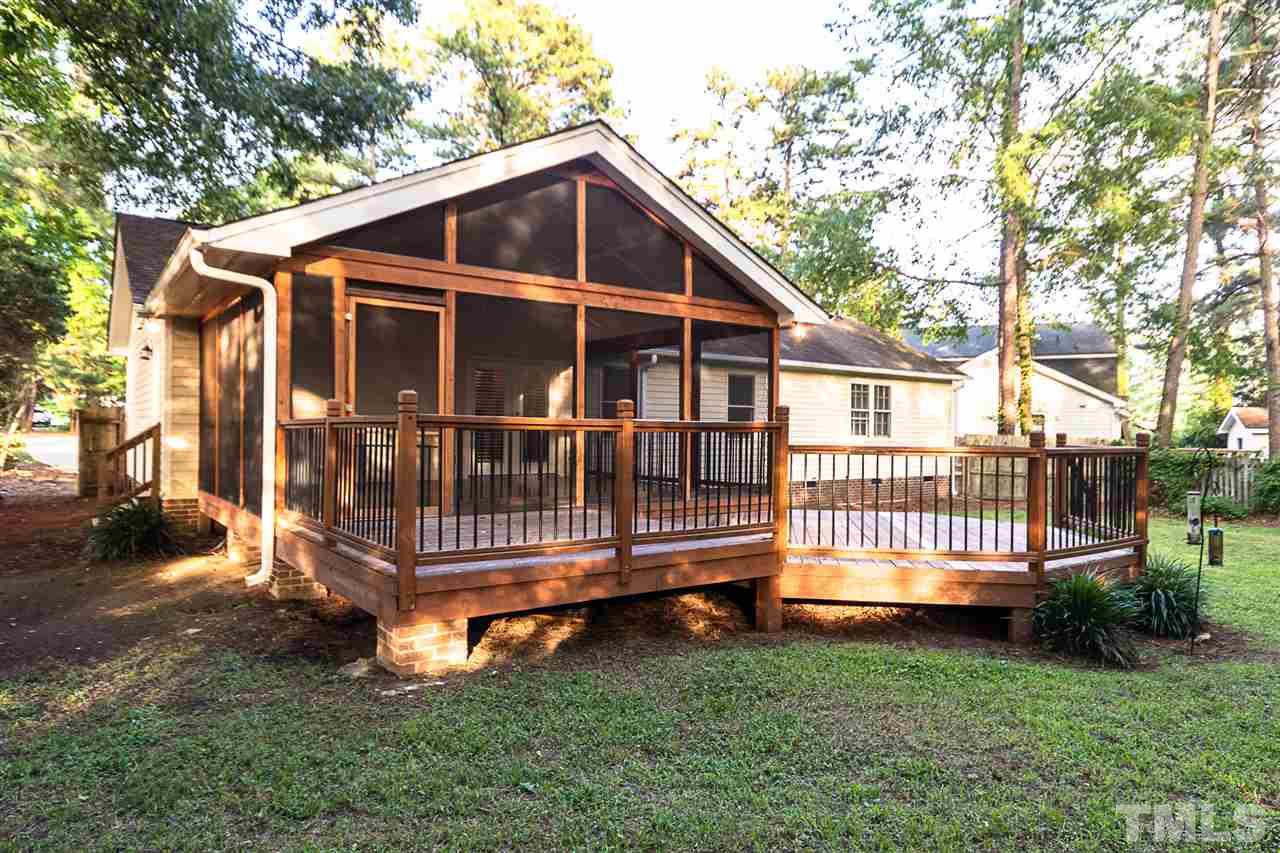 2332 Ravenhill Drive Raleigh, NC 27615 - Photo 22 of 25 a view of a house with a yard and deck