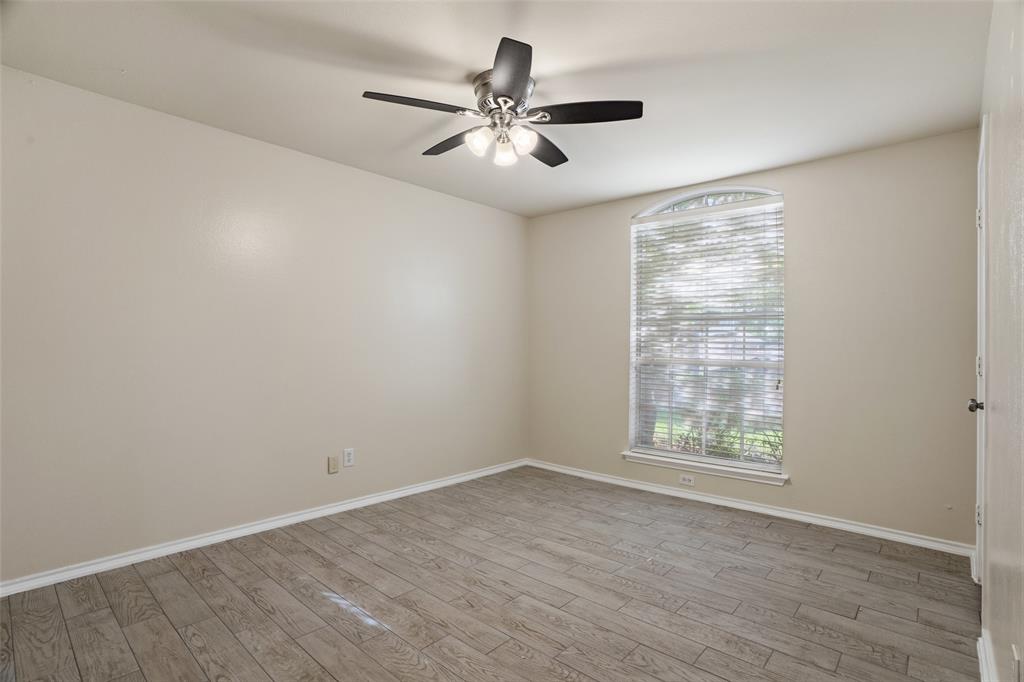 1204 Morrow Lane Allen, TX 75002 - Photo 12 of 19 wooden floor in an empty room with a window