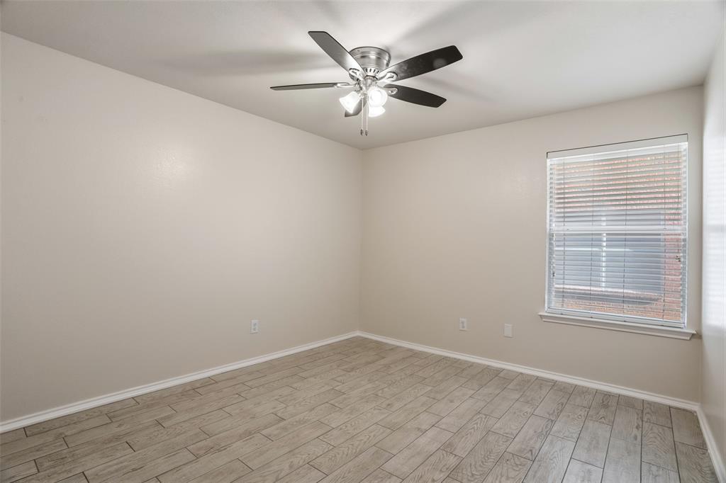 1204 Morrow Lane Allen, TX 75002 - Photo 13 of 19 an empty room with wooden floor and windows