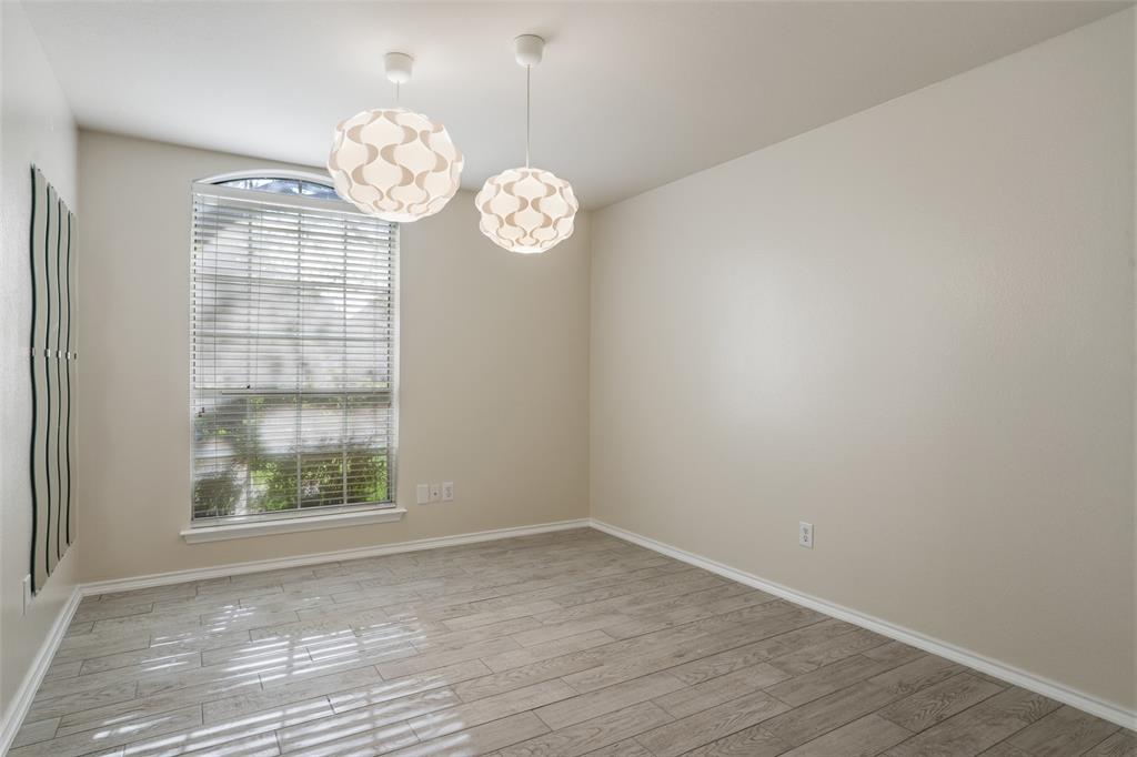 1204 Morrow Lane Allen, TX 75002 - Photo 14 of 19 an empty room with wooden floor and a window