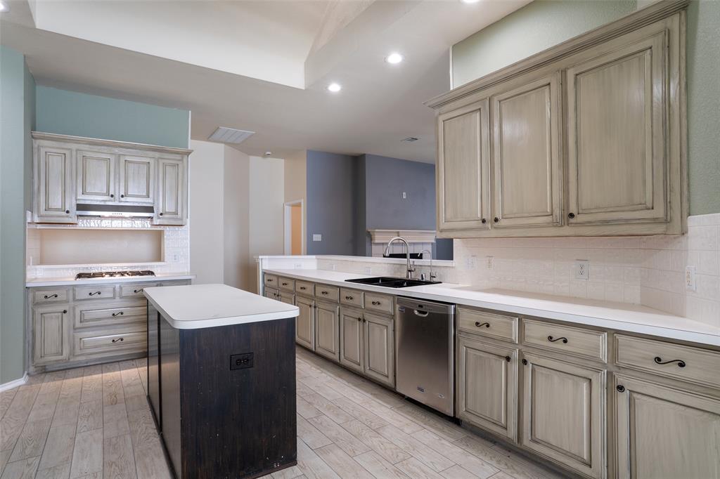 1204 Morrow Lane Allen, TX 75002 - Photo 4 of 19 a kitchen with white cabinets appliances and sink