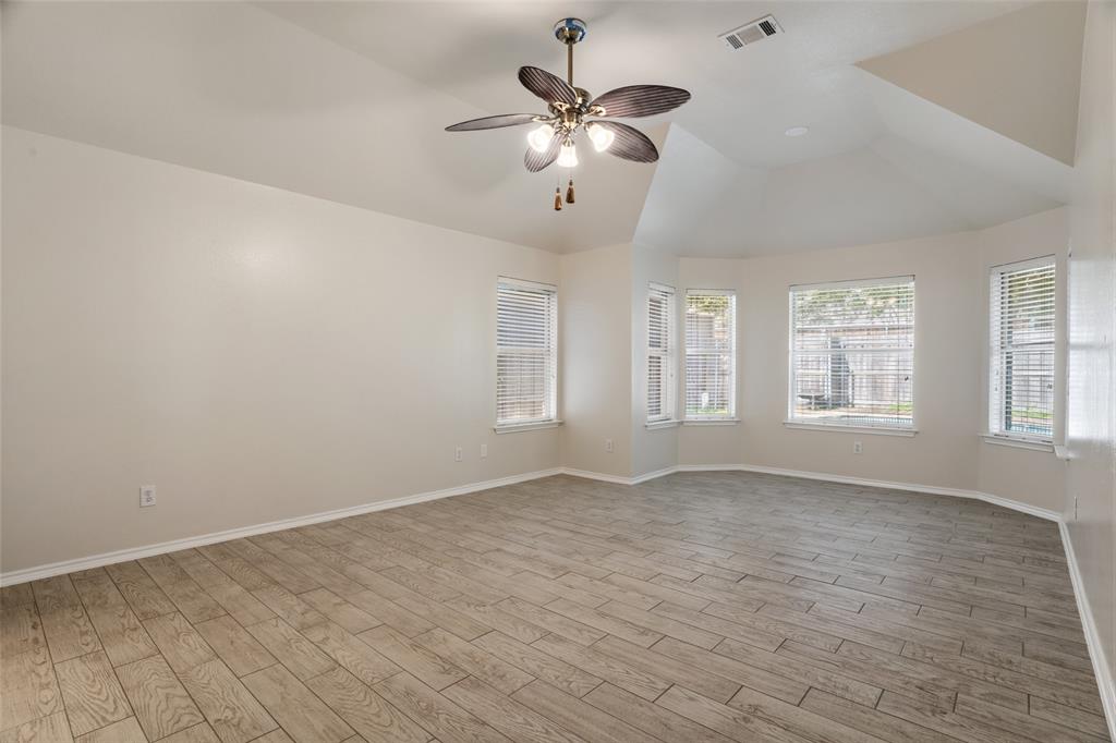 1204 Morrow Lane Allen, TX 75002 - Photo 7 of 19 wooden floor in an empty room with a window