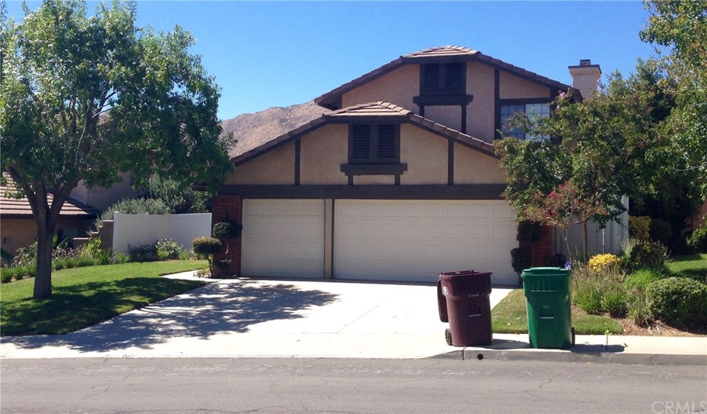 10709 Ridgefield Terrace Moreno Valley, CA 92557 - Photo 1 of 1 a front view of a house with a yard