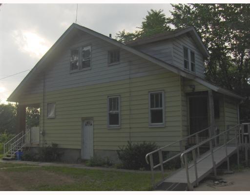 Exterior Front. With a little work you could make this Cute Story & a Half Shine!  Spacious Rooms sizes, Hardwood Flooring, Pretty Woodwork, Handicap accessable (motorized chair to bedrooms can be removed if you don t need)  Plenty of off street parking!
