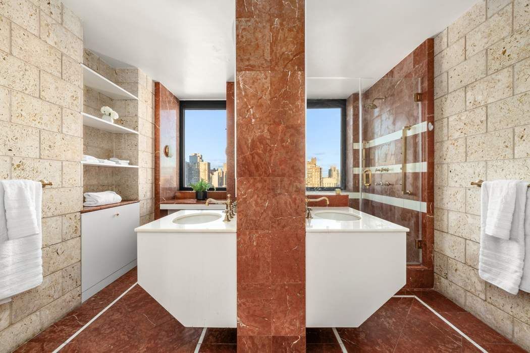 330 East 75th Street, Unit 28BC Manhattan, NY 10021 - Photo 15 of 20 a bathroom with sink and mirror