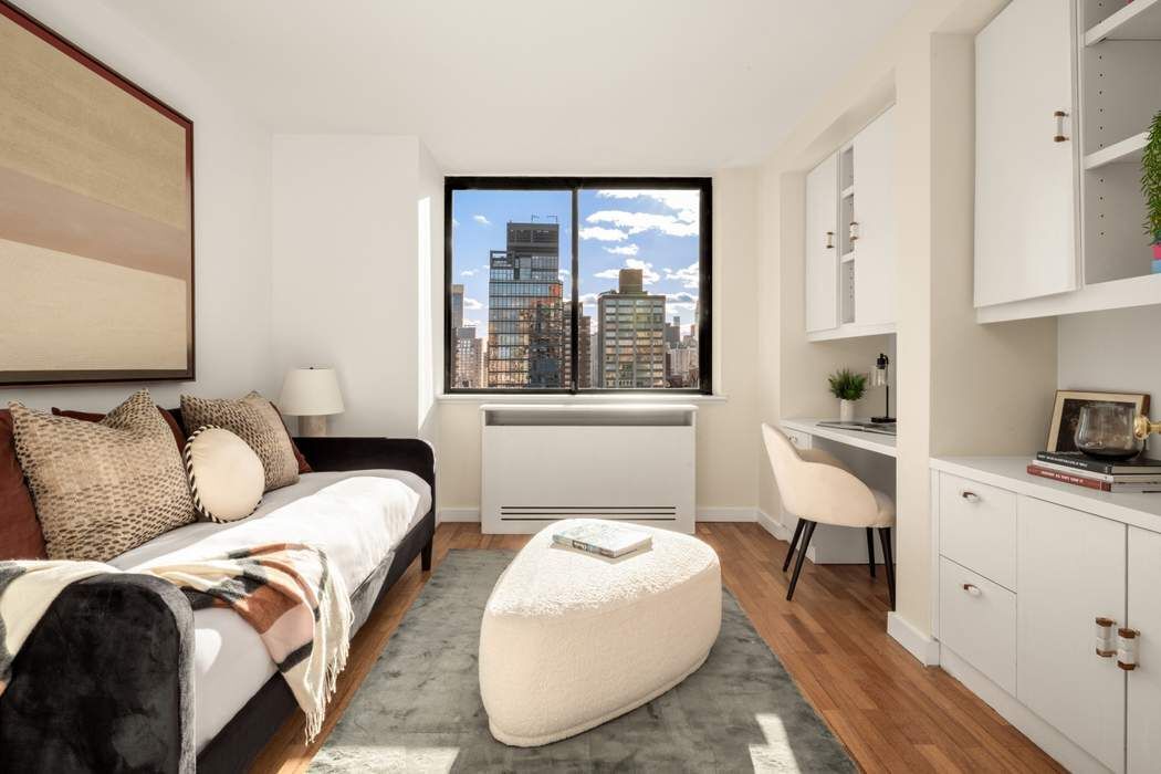 330 East 75th Street, Unit 28BC Manhattan, NY 10021 - Photo 17 of 20 a bedroom with bed and a window