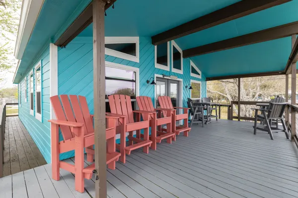a view of a chairs and table in deck of the house