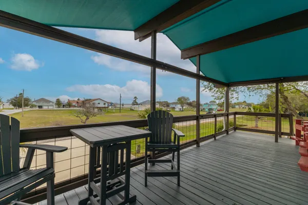 a view of swimming pool with outdoor seating