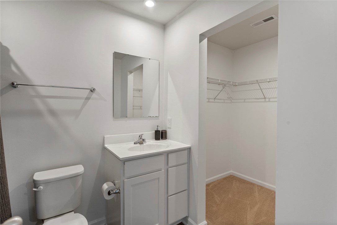 137 Nicklaus Drive Anderson, SC 29621 - Photo 23 of 37 Functional bathroom with ample vanity space and convenient closet access.