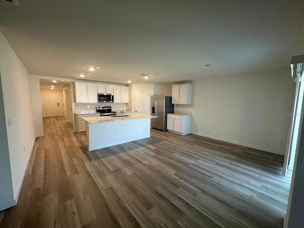 4697 Southwest 89th Street Ocala, FL 34476 - Photo 3 of 11 a view of kitchen with wooden floor