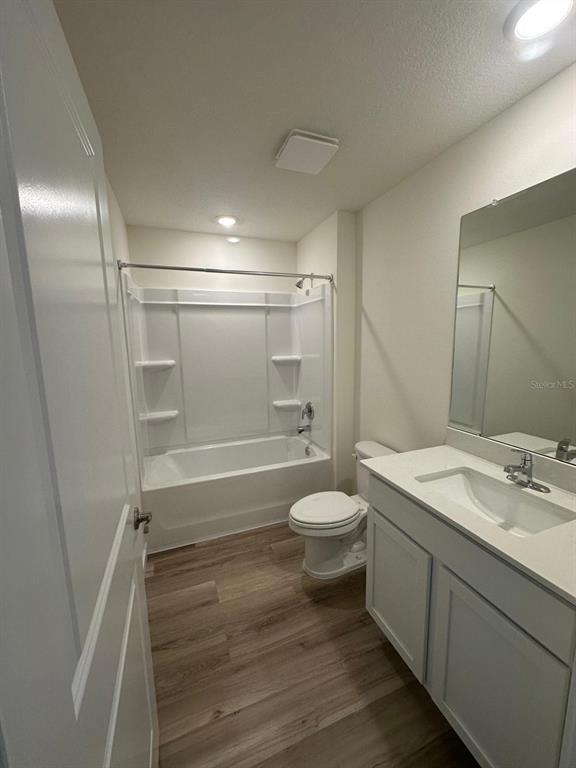 4697 Southwest 89th Street Ocala, FL 34476 - Photo 5 of 11 a bathroom with a sink a toilet and shower