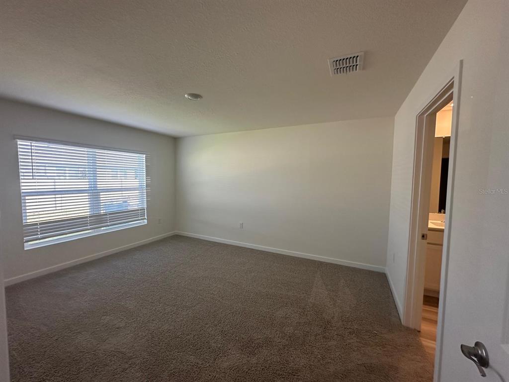 4697 Southwest 89th Street Ocala, FL 34476 - Photo 6 of 11 an empty room with a window