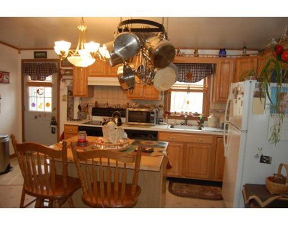 102 Clapp Road Hardwick, MA 01037 - Photo 3 of 11 a kitchen with a sink cabinets and window