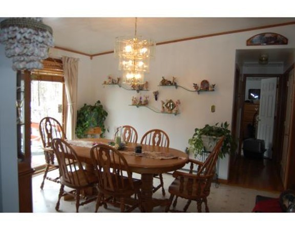 102 Clapp Road Hardwick, MA 01037 - Photo 4 of 11 a view of a dining room with furniture and chandelier