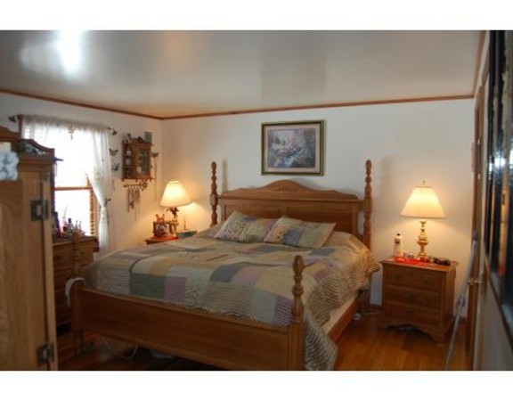 102 Clapp Road Hardwick, MA 01037 - Photo 5 of 11 a bedroom with a bed and a lamp