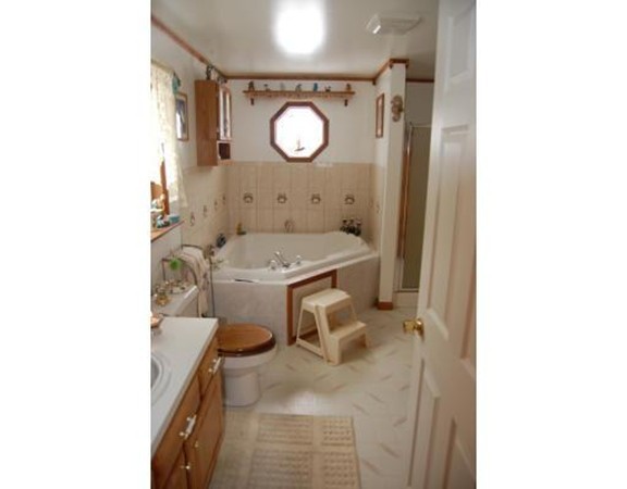 102 Clapp Road Hardwick, MA 01037 - Photo 6 of 11 a bathroom with a sink toilet and mirror