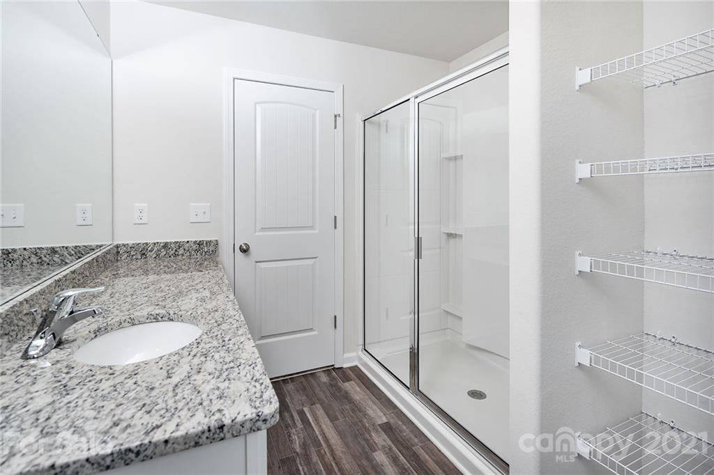 226 Caley Street Kings Mountain, NC 28086 - Photo 11 of 12 a bathroom with a granite countertop sink and shower