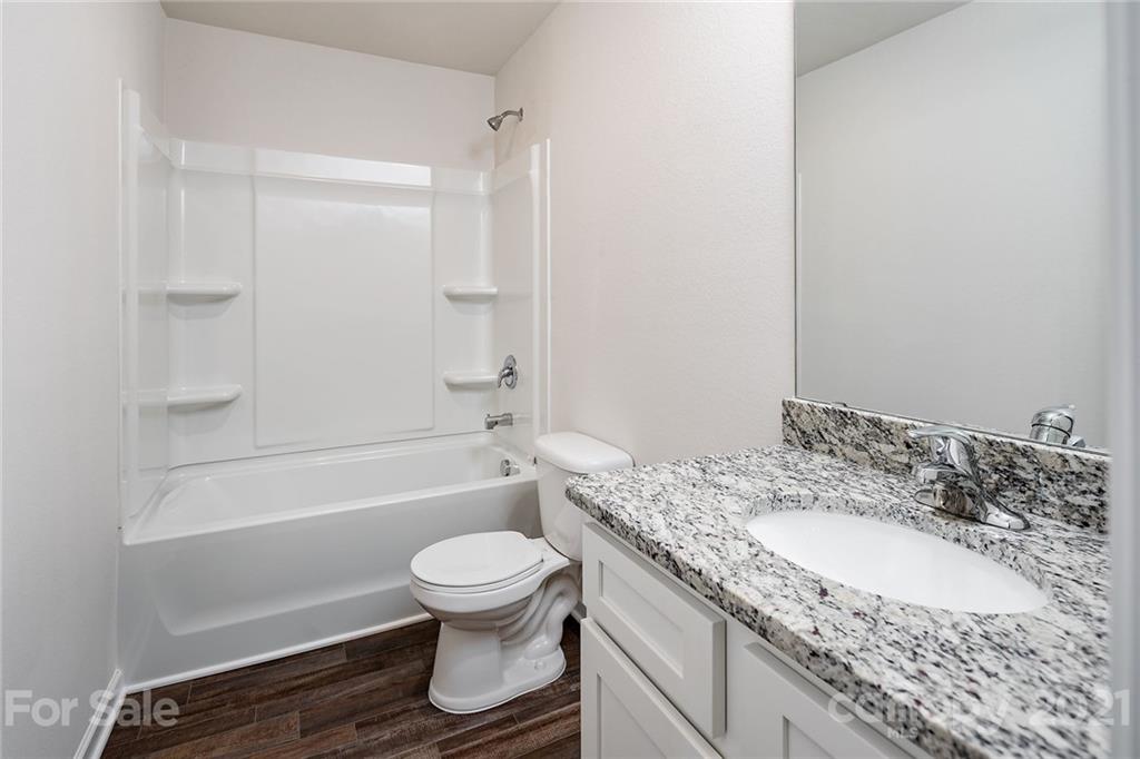 226 Caley Street Kings Mountain, NC 28086 - Photo 12 of 12 a bathroom with a granite countertop sink toilet and shower