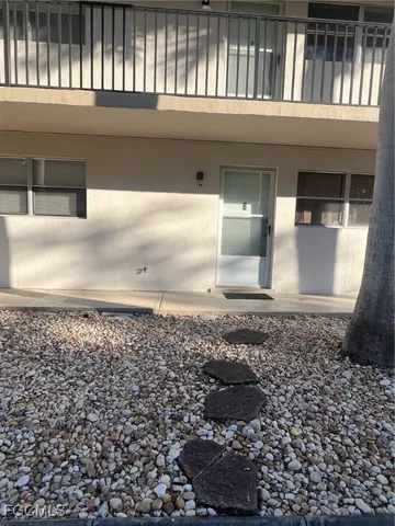 a view of a hallway with wooden fence