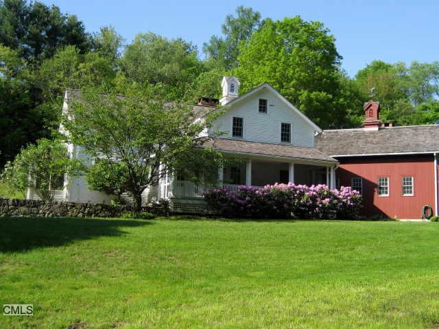 a front view of house with garden