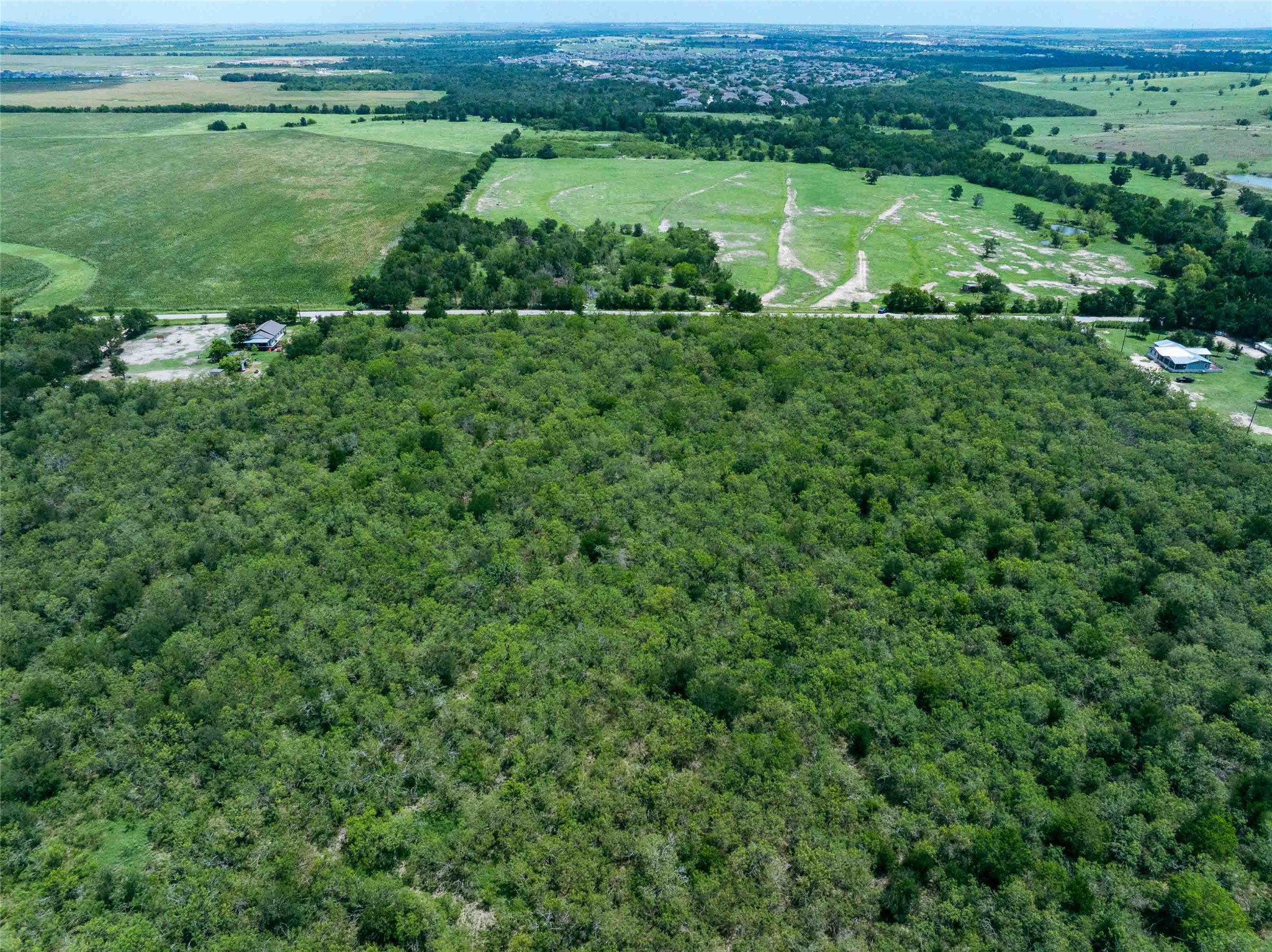17715 Albert Voelker Road Elgin, TX 78621 - Photo 13 of 19 a view of a green field with lots of green space