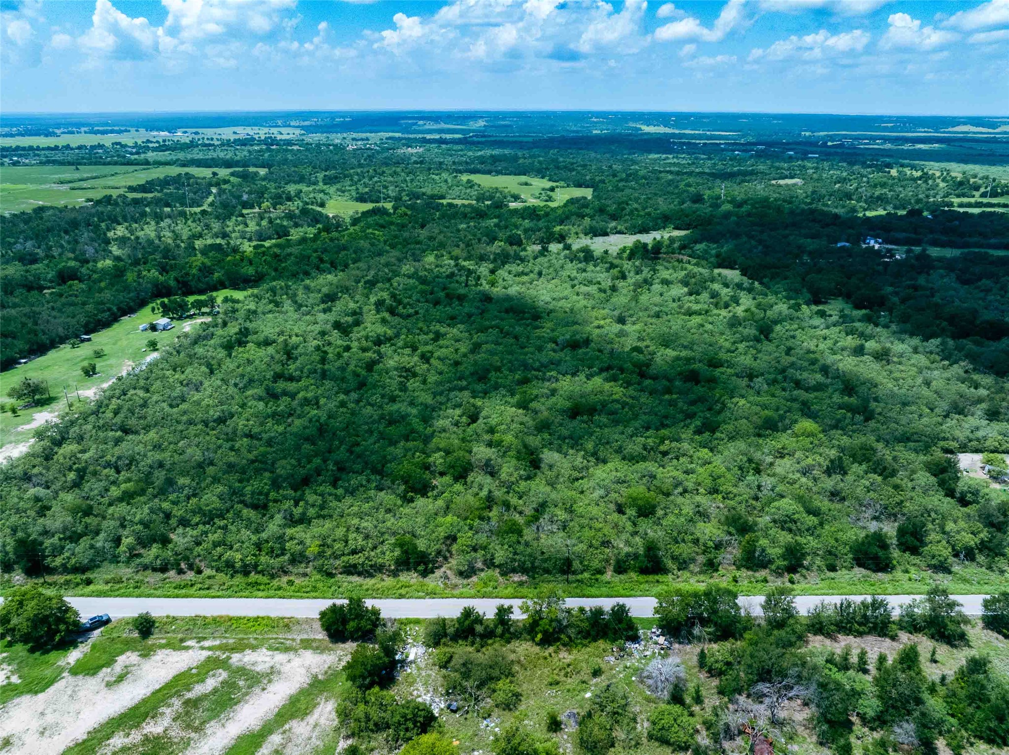 17715 Albert Voelker Road Elgin, TX 78621 - Photo 3 of 19 a view of a field with an ocean
