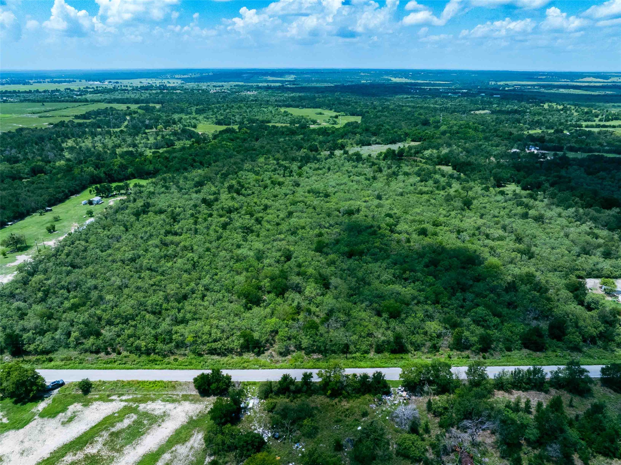 17715 Albert Voelker Road Elgin, TX 78621 - Photo 4 of 19 a view of a field with an ocean