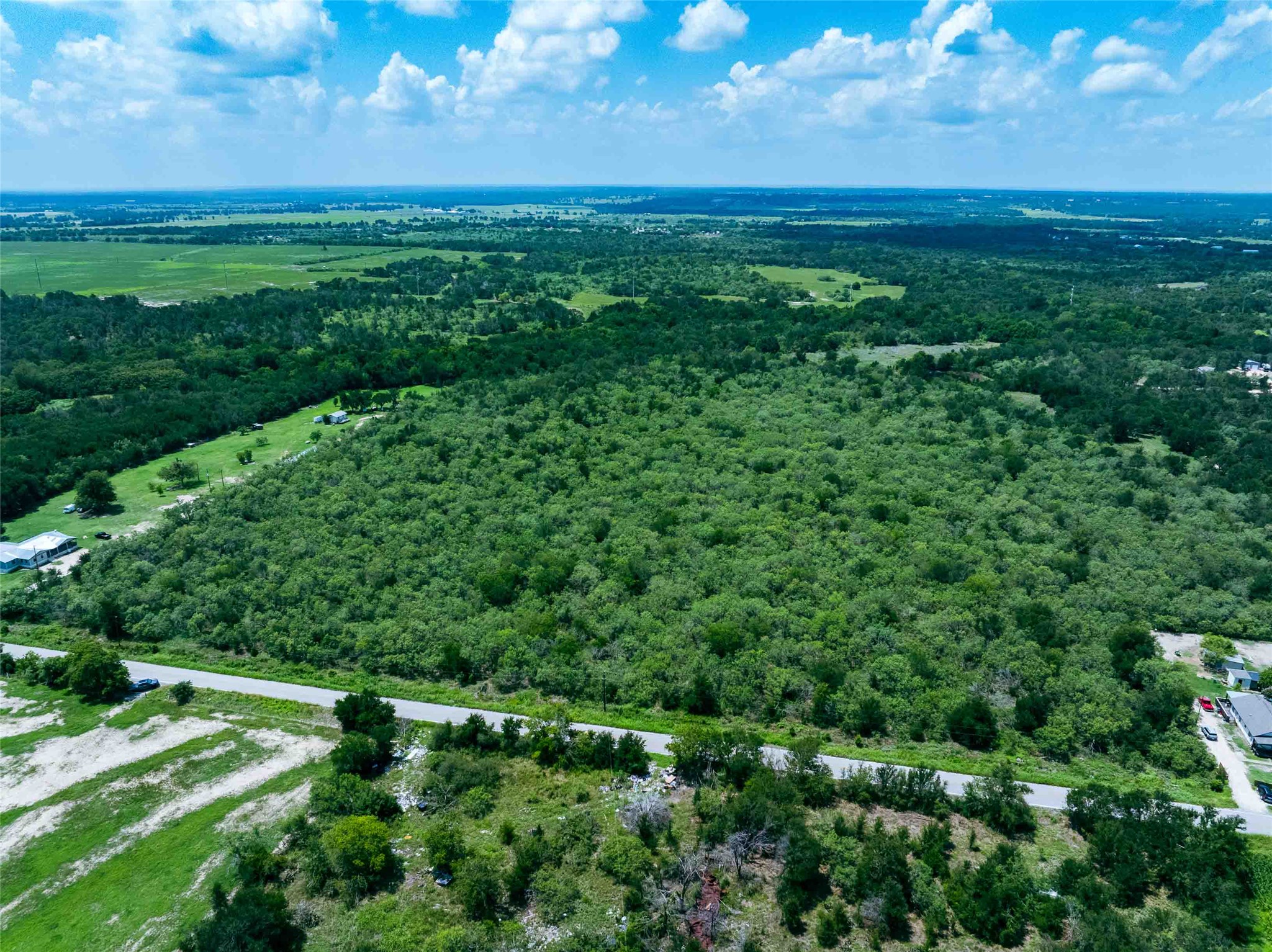 17715 Albert Voelker Road Elgin, TX 78621 - Photo 6 of 19 a view of a field with an outdoor space