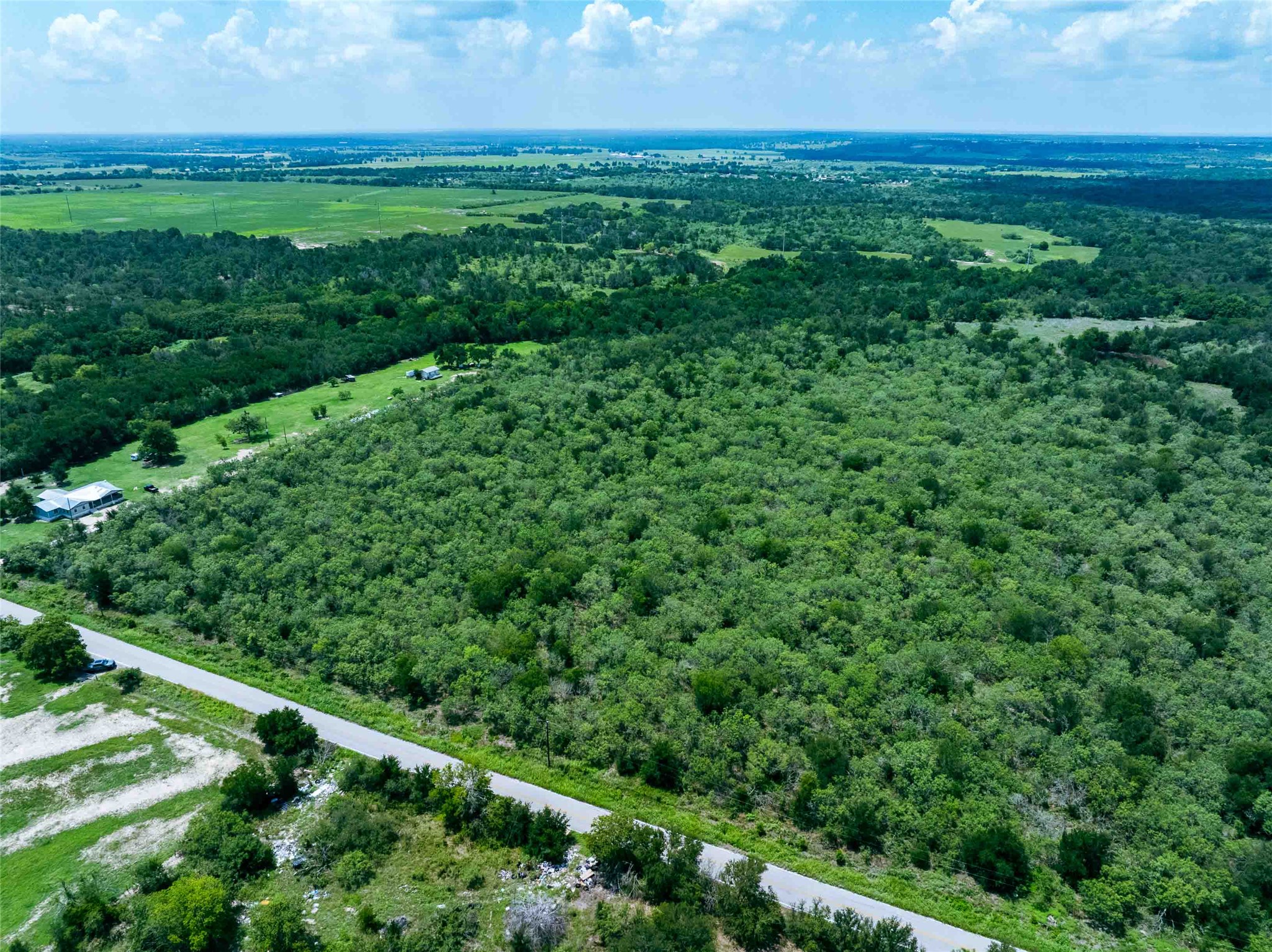 17715 Albert Voelker Road Elgin, TX 78621 - Photo 7 of 19 a view of a lush green space