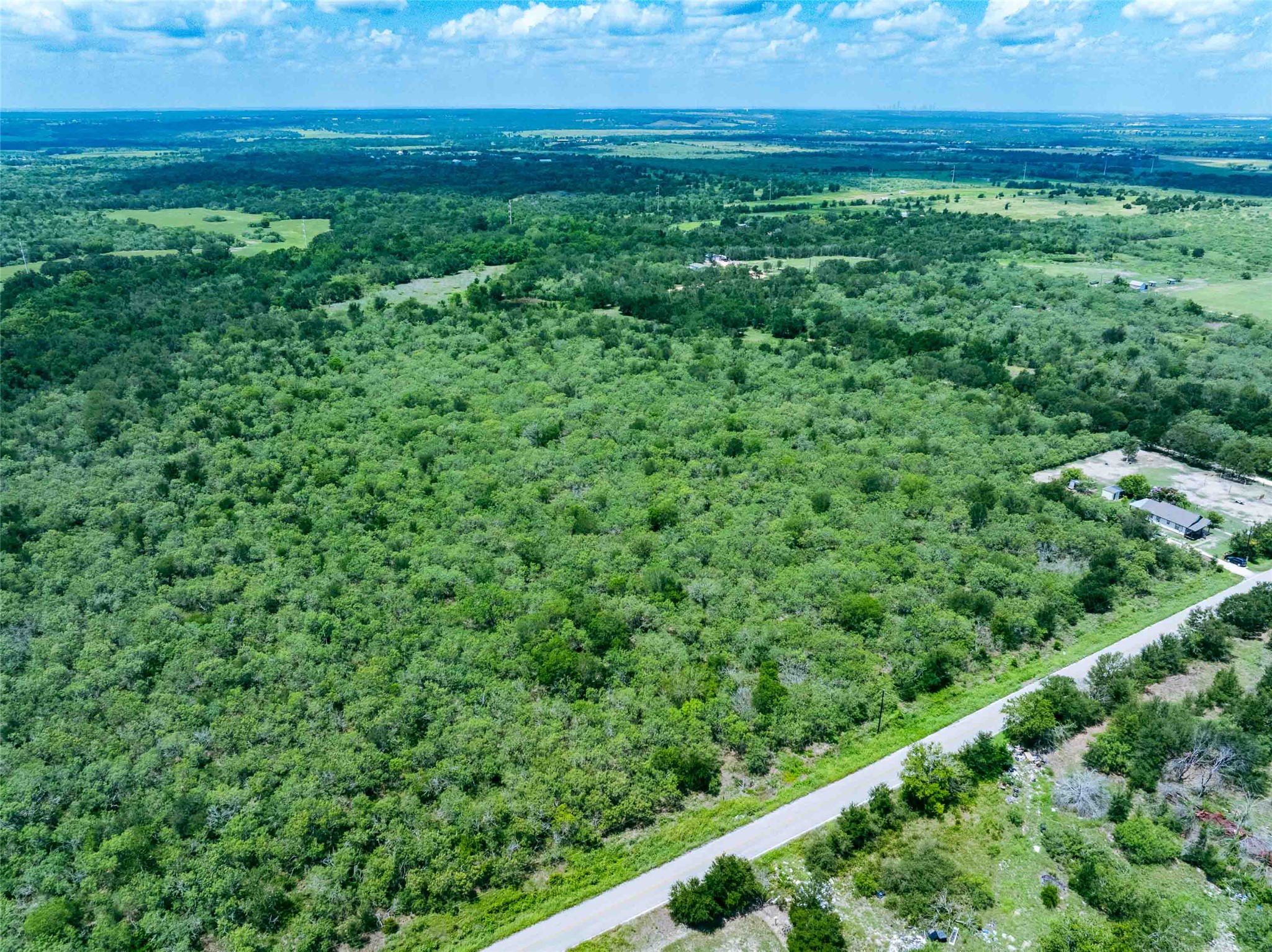 17715 Albert Voelker Road Elgin, TX 78621 - Photo 9 of 19 a view of yard with green space