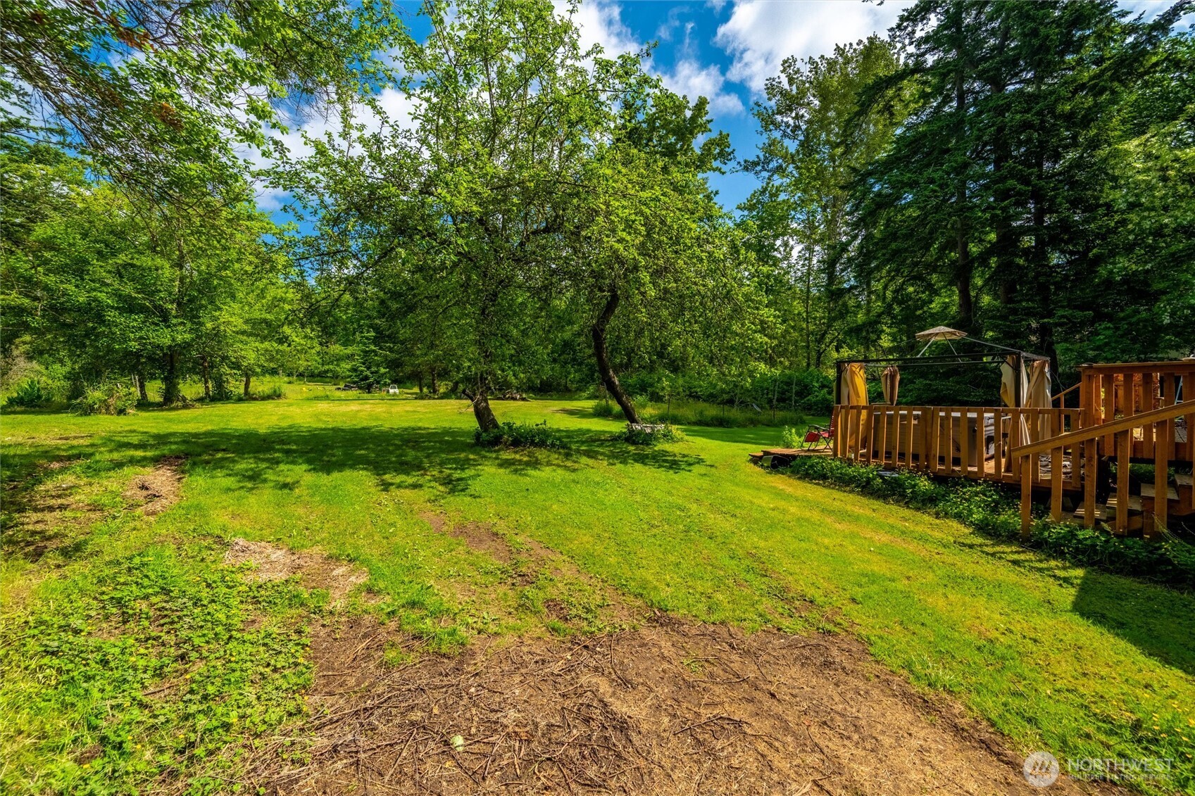 970 East Bakerview Road Bellingham, WA 98226 - Photo 3 of 16 a view of a park with swings and a trees
