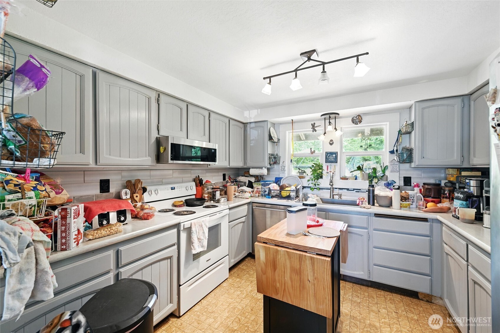 970 East Bakerview Road Bellingham, WA 98226 - Photo 8 of 16 a kitchen with a sink window and cabinets