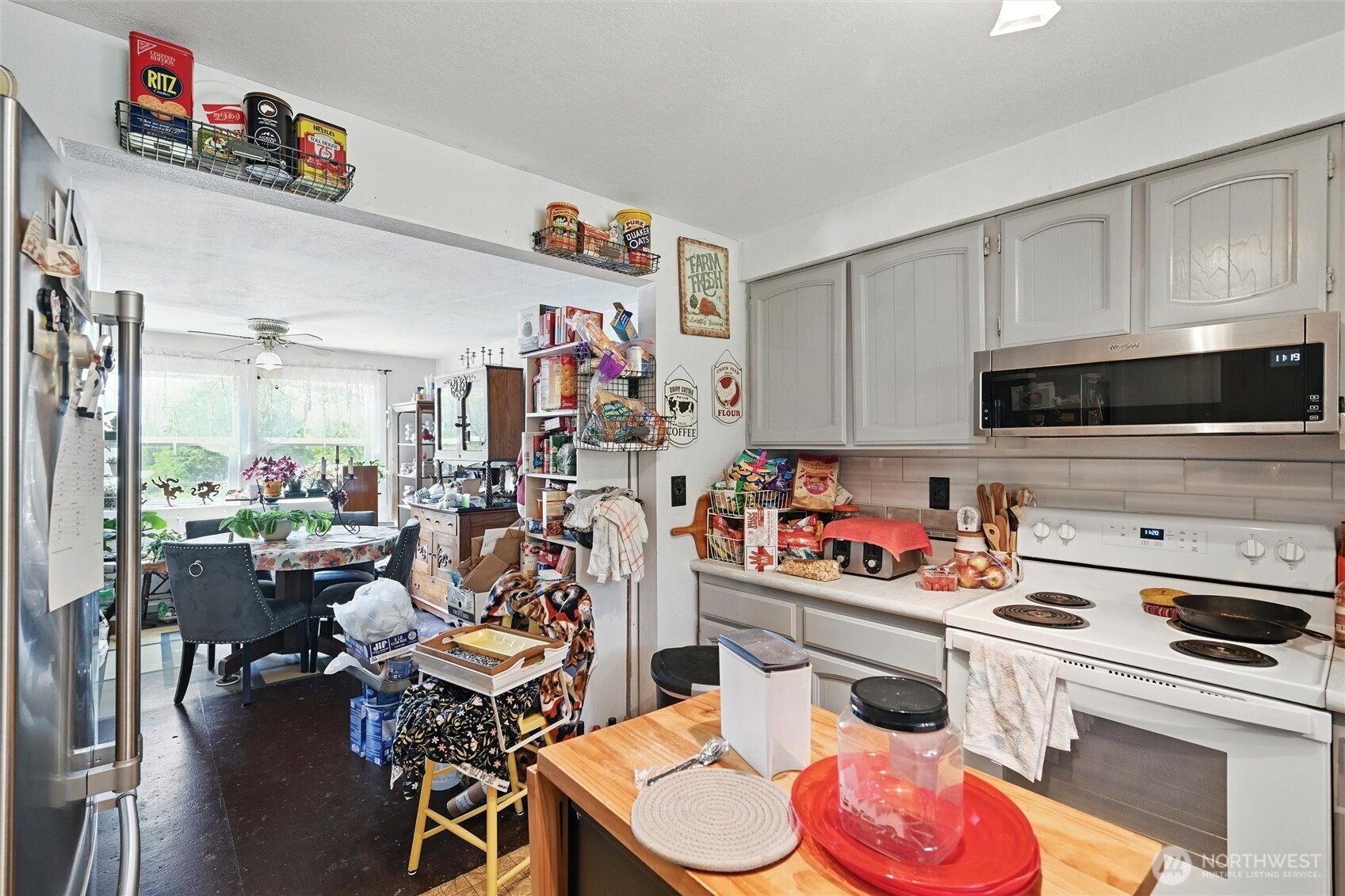 970 East Bakerview Road Bellingham, WA 98226 - Photo 9 of 16 a kitchen with a refrigerator and a stove top oven