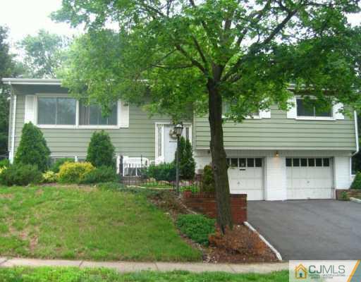 47 Wilk Road Edison, NJ 08837 - Photo 1 of 8 a front view of a house with a yard