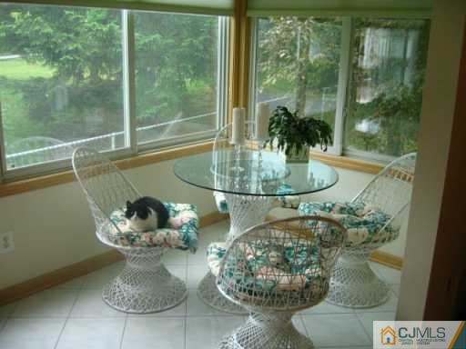 47 Wilk Road Edison, NJ 08837 - Photo 4 of 8 a vase of flowers sitting on a table