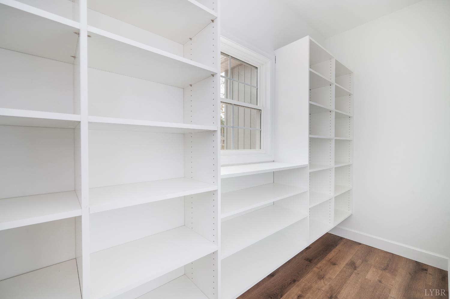 11218 Leesville Road Evington, VA 24550 - Photo 11 of 54 a view of walk in closet with empty racks