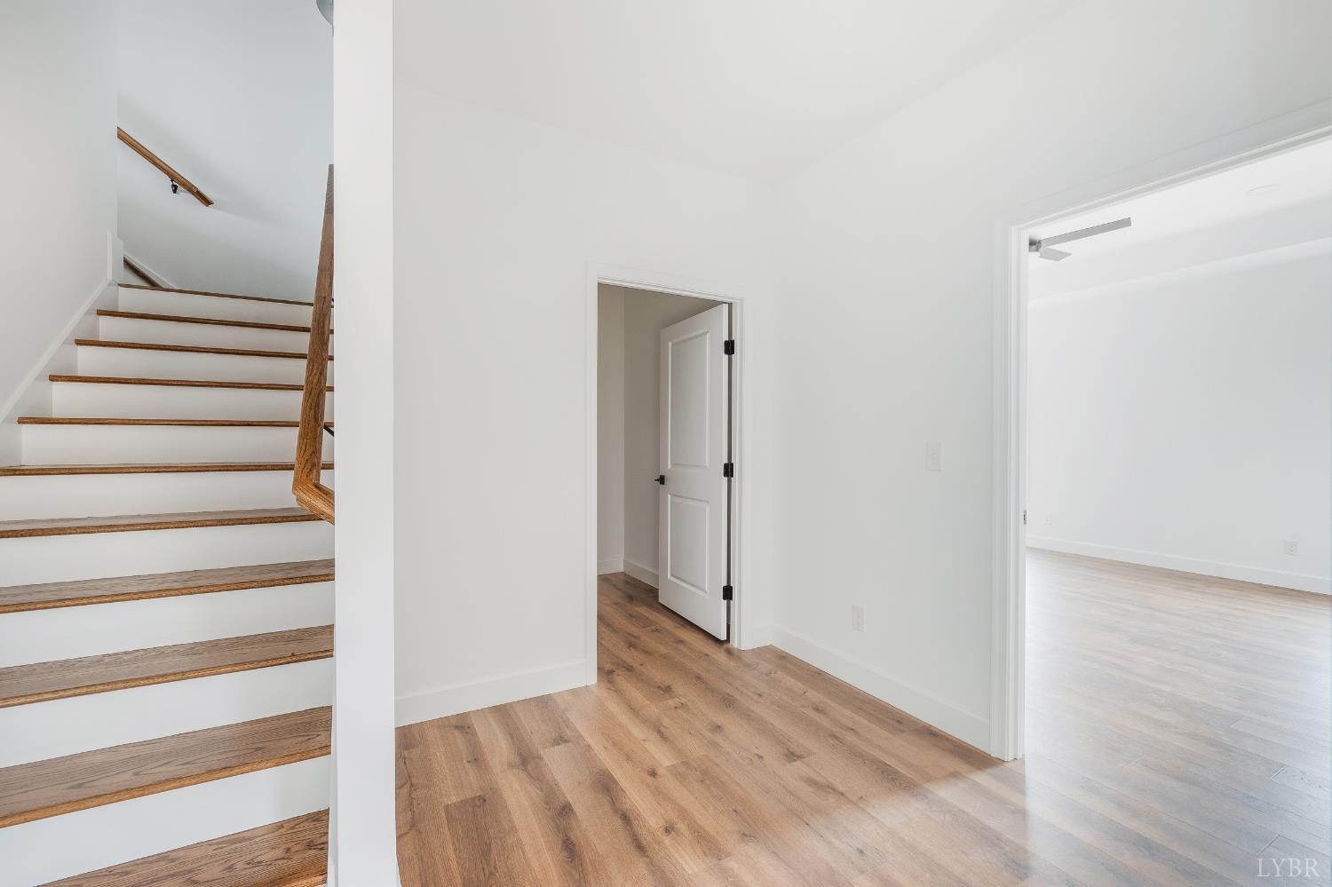 11218 Leesville Road Evington, VA 24550 - Photo 14 of 54 a view of a hallway with wooden floor and entryway