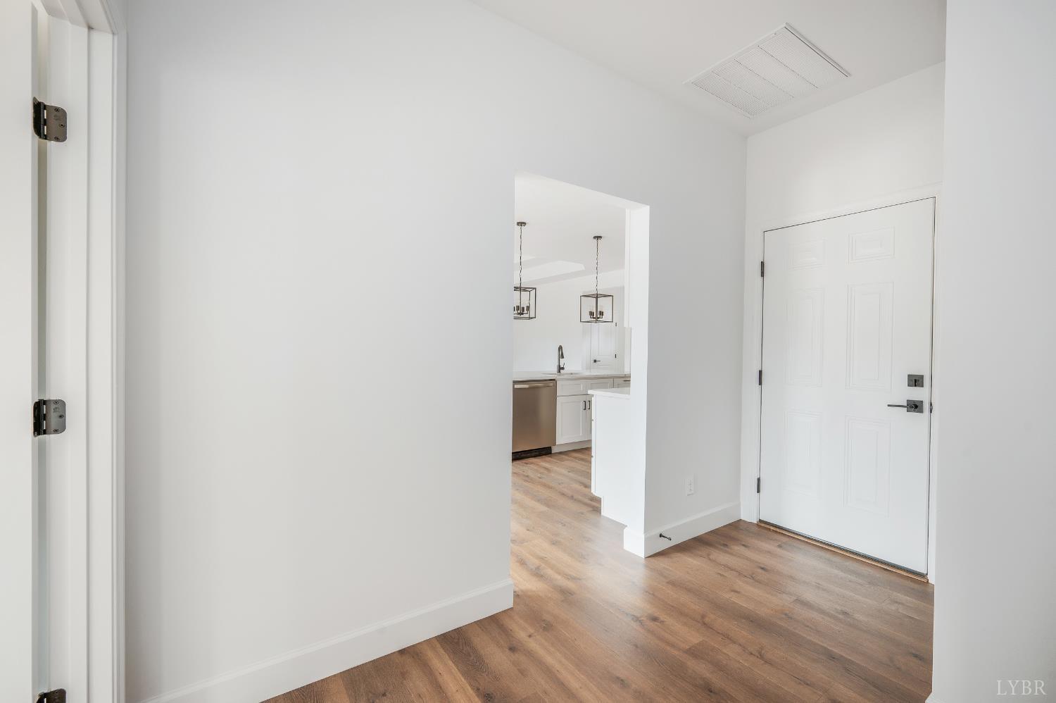 11218 Leesville Road Evington, VA 24550 - Photo 15 of 54 a view of a hallway with wooden floor