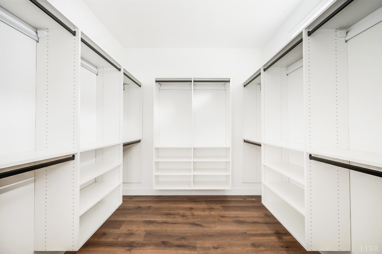 11218 Leesville Road Evington, VA 24550 - Photo 25 of 54 a view of walk in closet with empty racks