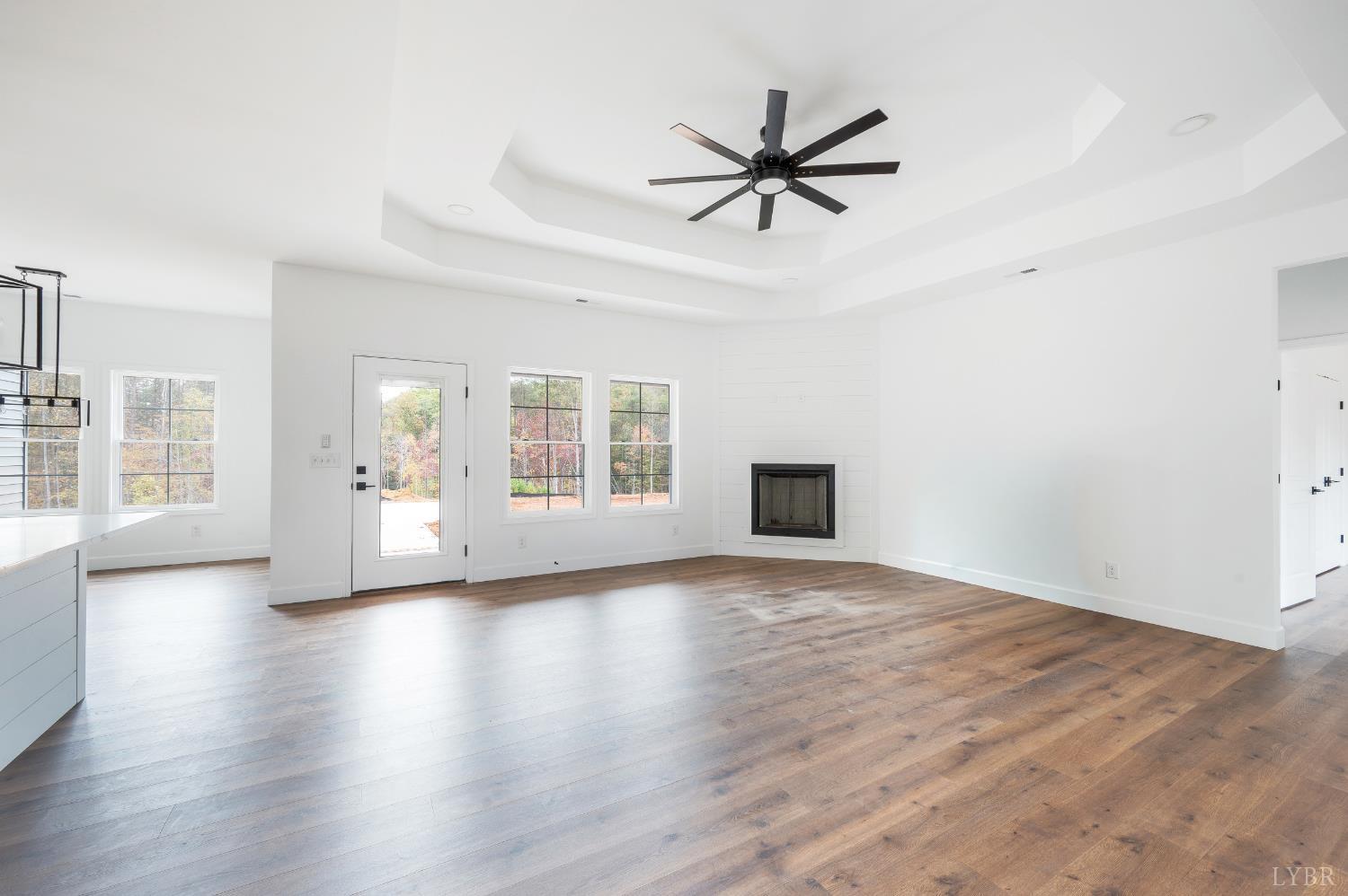 11218 Leesville Road Evington, VA 24550 - Photo 30 of 54 a view of empty room with wooden floor and fan