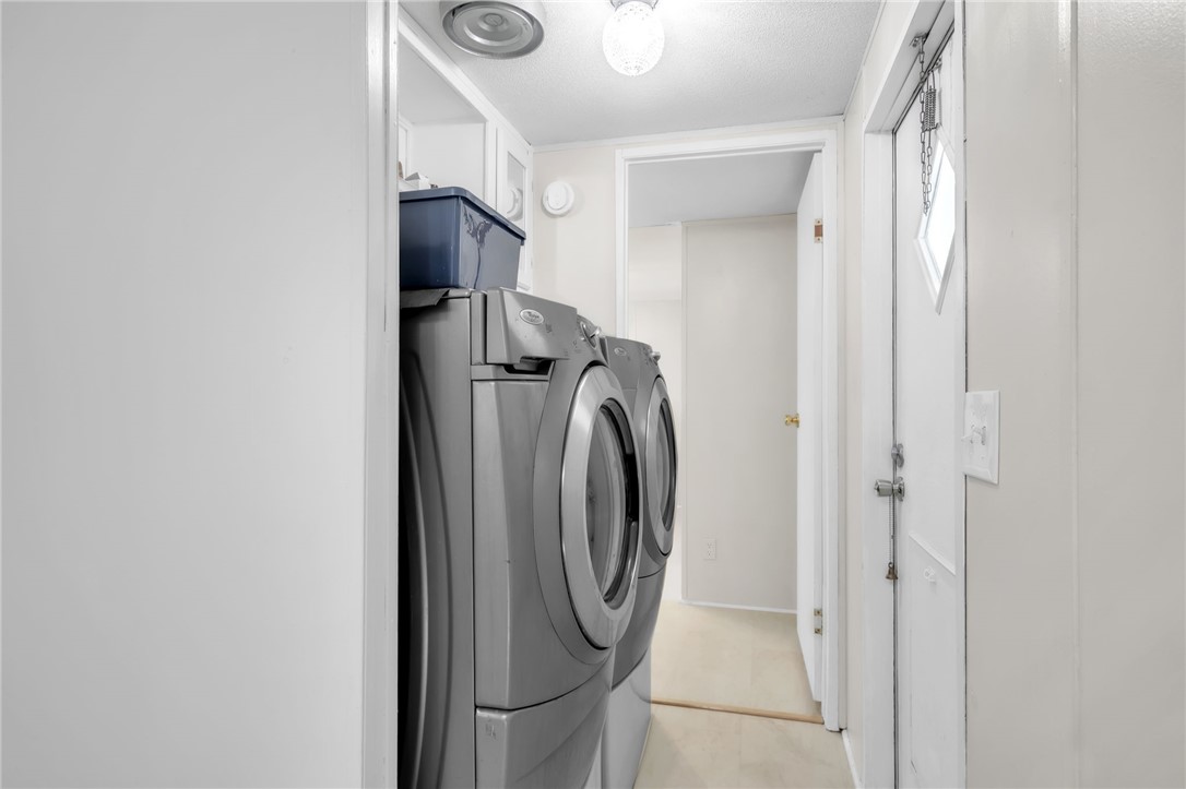 506 Charlies Creek Road Iva, SC 29655 - Photo 20 of 28 Functional laundry space featuring modern appliances and convenient storage solutions.