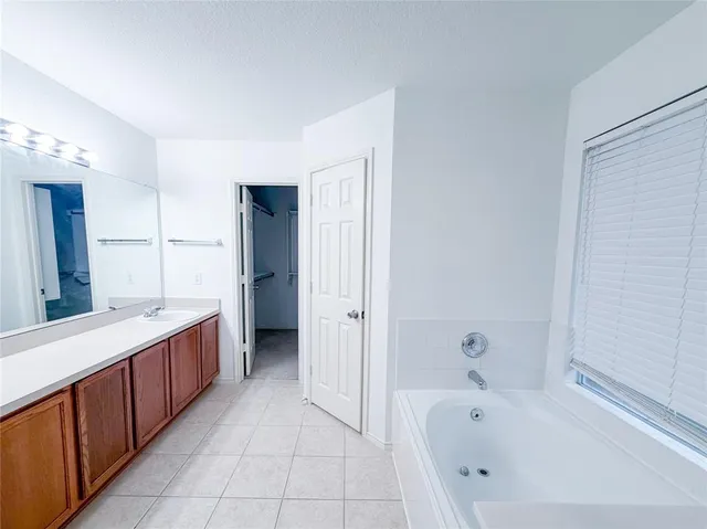 a bathroom with a bathtub and a sink