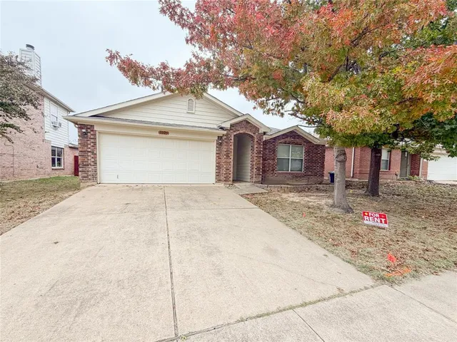 a front view of a house with a garage