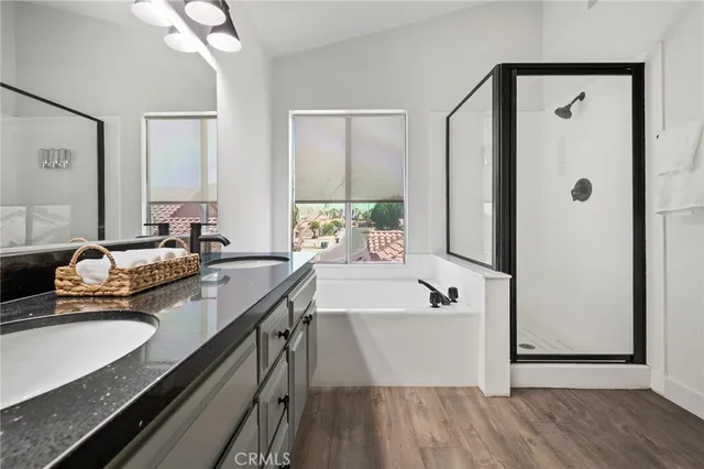 a bathroom with a sink vanity and a mirror