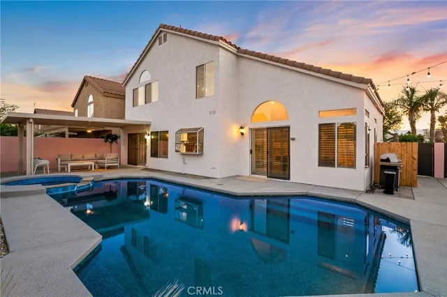 a view of house with a swimming pool